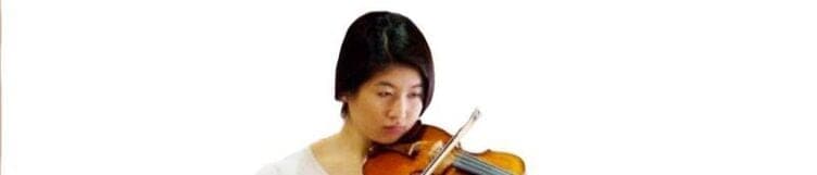A violinist performing at the school
